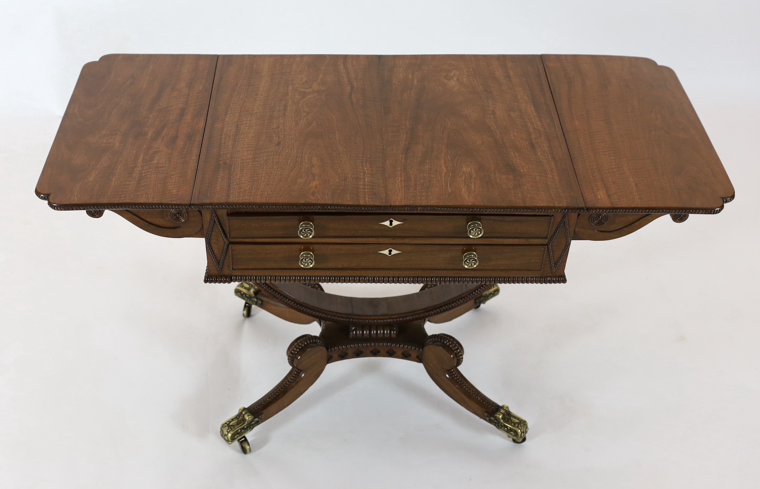 A Regency mahogany drop leaf work table, width extended 122cm, depth 50cm, height 71cm